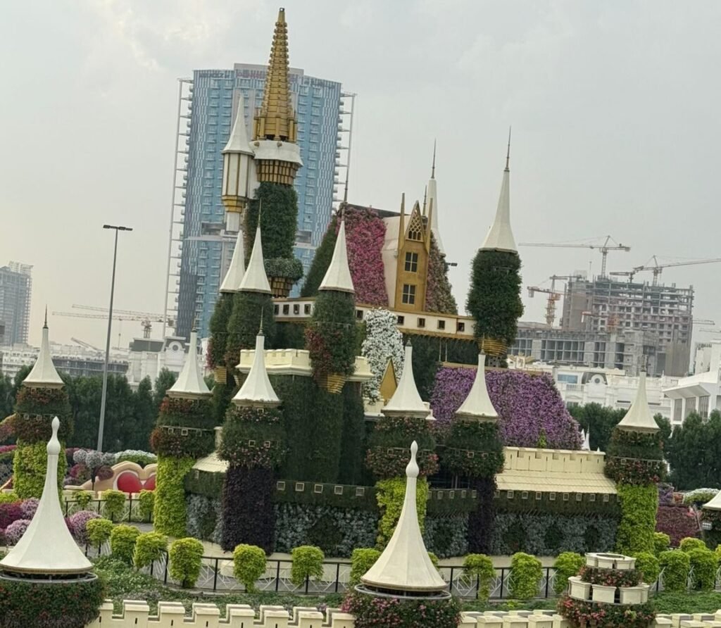 Luxury villa landscaping in Abu Dhabi featuring manicured lawns, palm trees, and modern hardscape design